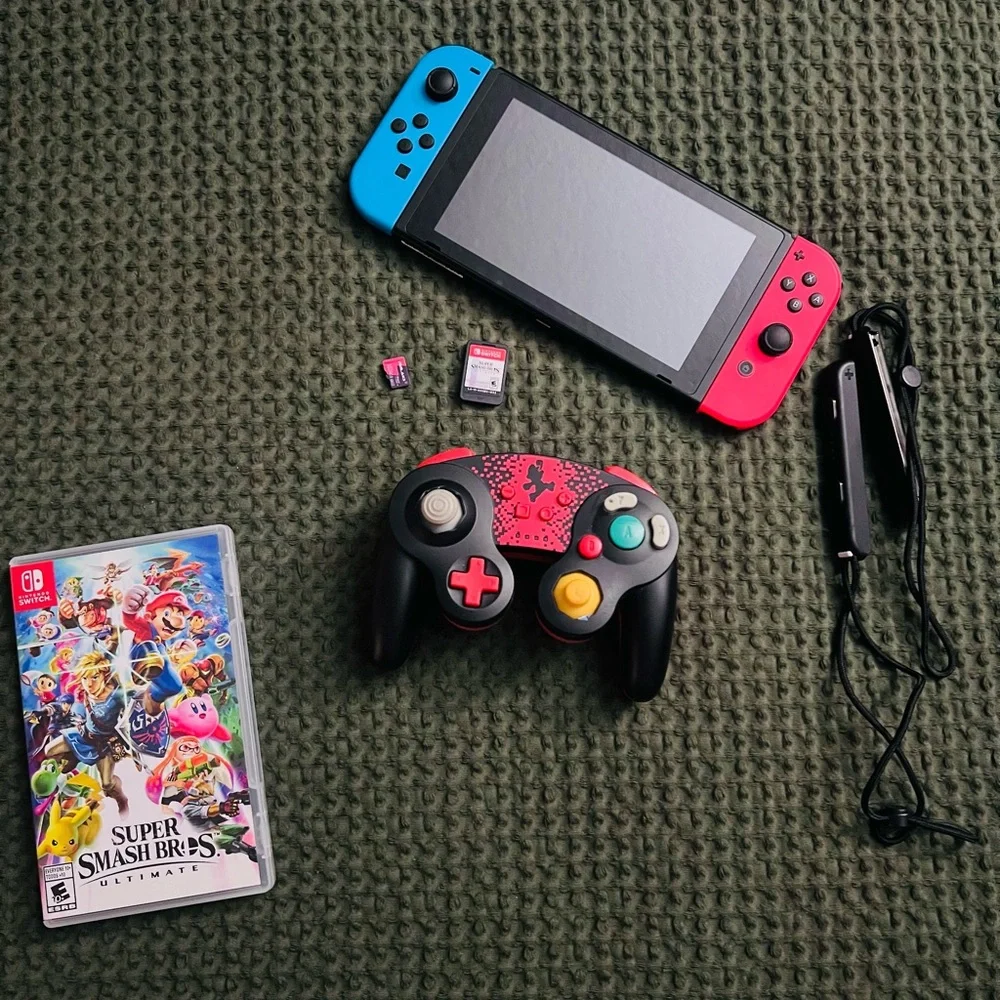 Nintendo Switch Console with Red & Blue Joy-Cons and Black Pro-Style Controller